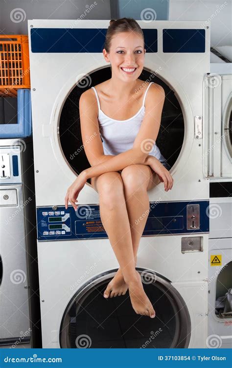 woman sitting on washing machine|sitting on a washer machine.